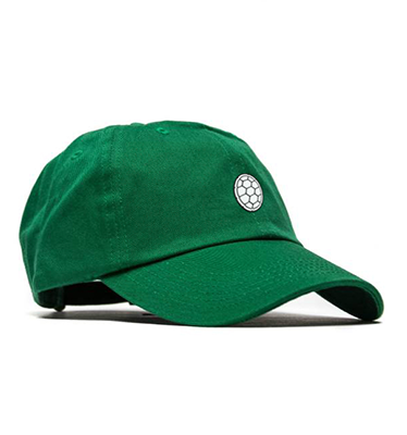 The shell logo is displayed on the front of a green baseball cap